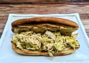 A Slow Cooker Chicken Pepperoncini Cheesesteaks on a white plate