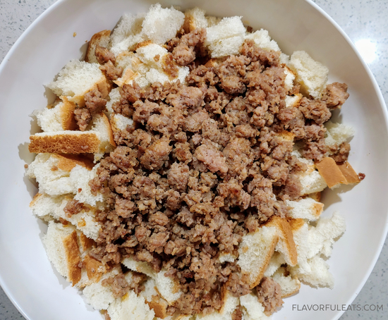 Cooked sausage added to bread for Mom's Sausage Stuffing