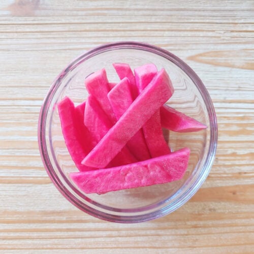 Middle Eastern Pickled Turnips in a small glass bowl.