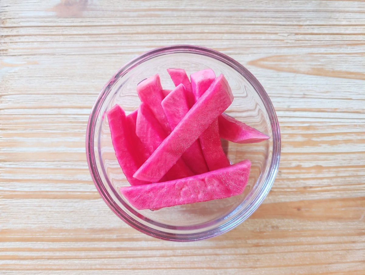 Middle Eastern Pickled Turnips in a small glass bowl.
