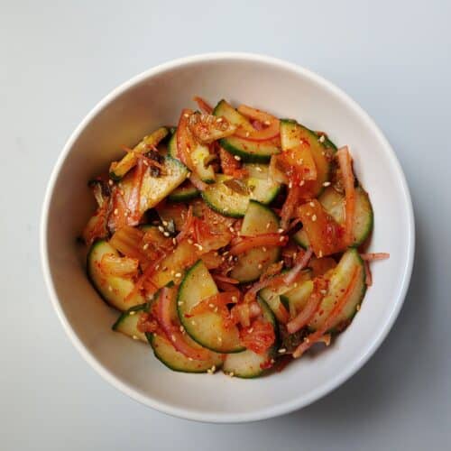 Kimchi Cucumber Salad in a white bowl.
