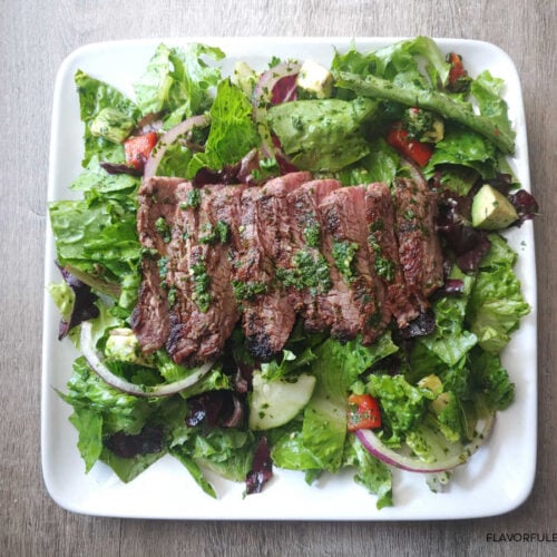 Chimichurri Steak Salad on a white plate.
