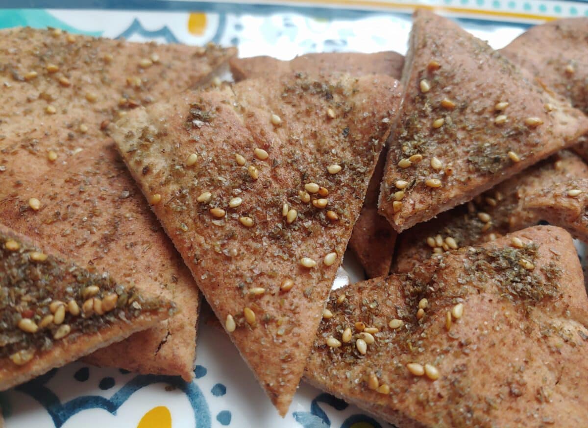 An up close photo of Toasted Za'atar Pita Chips showing the seasonings.