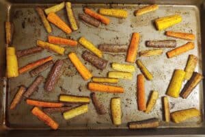 Curry Spiced Roasted Carrots on a baking sheet after they've cooked.