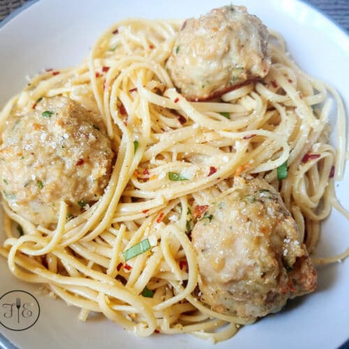 The Best Italian Chicken Meatballs with pasta in a white bowl.