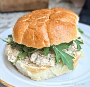 Dill Pickle Tuna Salad on a roll with arugula