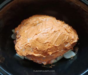 Slow Cooker Cajun Butter Turkey Breast after it's slathered in butter, before it's cooked.