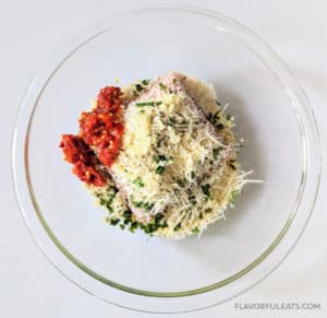A bowl of ingredients to make Calabrian Chicken Meatballs