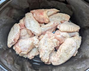 Raw chicken wings in the slow cooker