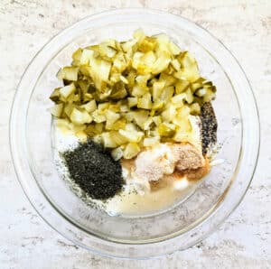 Bowl with all the ingredients to make Dill Pickle Dip before they're combined.