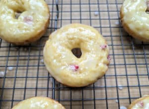 Baked Strawberry Lemon Donuts on a wire rack