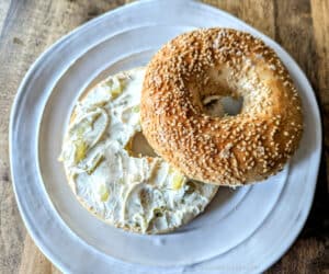 Dill Pickle Cream Cheese Spread on a toasted bagel