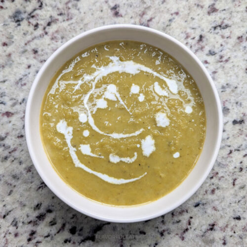 Slow Cooker Asparagus Leek Soup in a white bowl