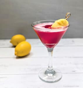 Hawaiian Smash Martini on a table next to lemons.