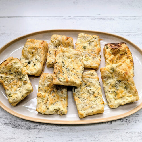 Dill Pickle Puff Pastry Appetizers on a white serving platter