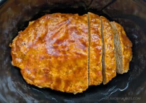 Slow Cooker BBQ Cheddar Turkey Meatloaf in the slow cooker with a couple of slices cut into it