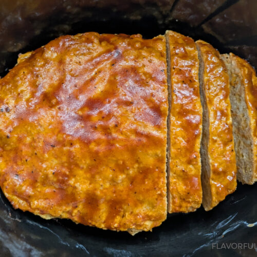 Slow Cooker BBQ Cheddar Turkey Meatloaf in the slow cooker with a couple of slices cut into it