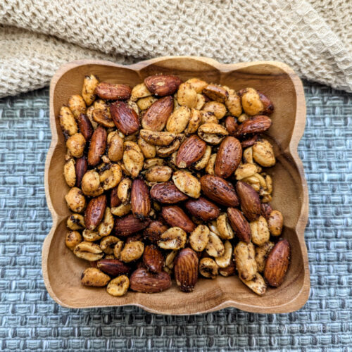 Ghost Pepper Roasted Nuts in a square wooden bowl.