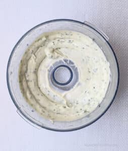 The herby mayo in a mini food processor for Fried Egg Sandwich with Herby Mayo.
