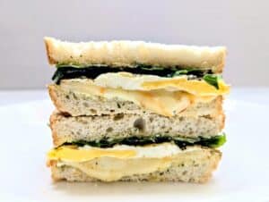 Fried Egg Sandwich with Herby Mayo cut in half and stacked on top of each other.