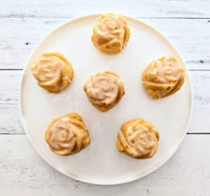 Mini Lemon Rose Bundt Cakes on a white plate.