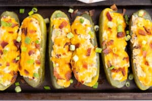 Air Fryer Chicken Bacon Ranch Stuffed Pickles on a baking sheet.
