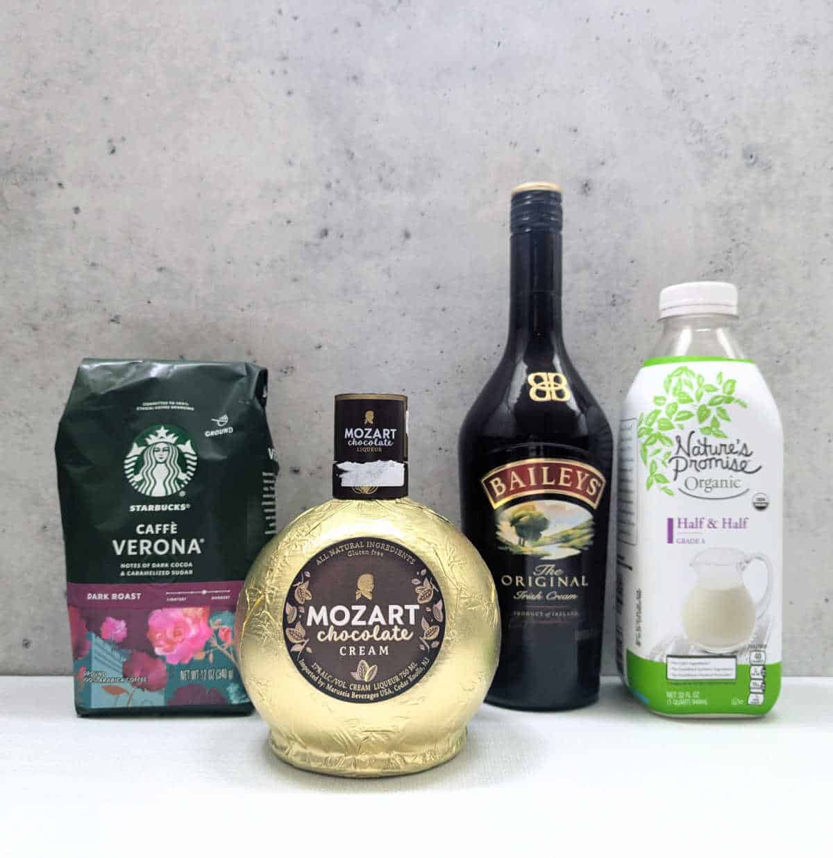 The ingredients needed to make Slow Cooker Boozy Chocolate Coffee: coffee, chocolate liqueur, Baileys Irish Cream, and half & half.