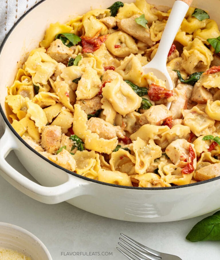 One-Pan Creamy Chicken & Tortellini in a pan with a serving spoon.