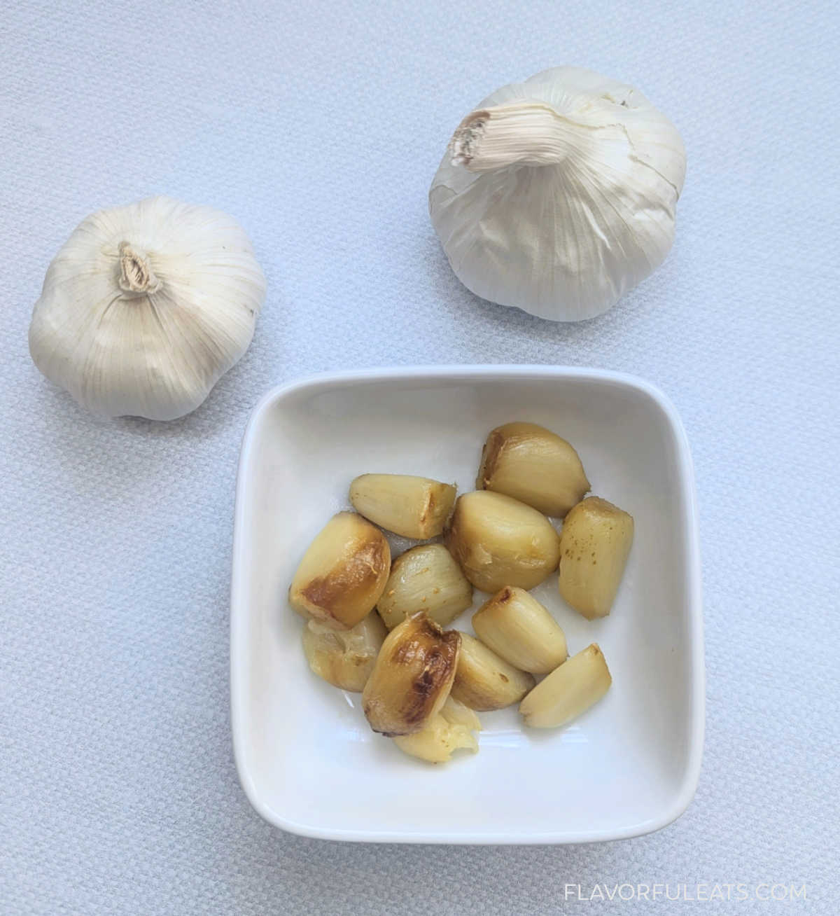 Air Fryer Roasted Garlic in a small plate.