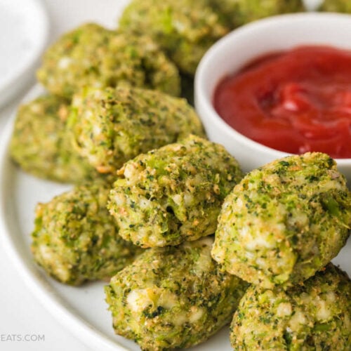 Baked Mozzarella Broccoli Tots on a serving platter with ketchup.