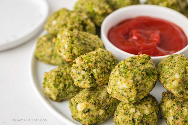 Baked Mozzarella Broccoli Tots on a serving platter with ketchup.
