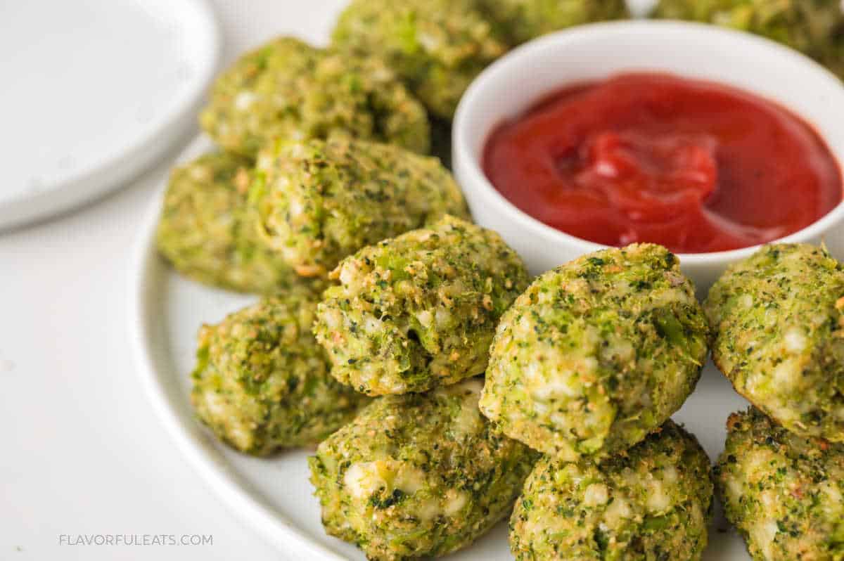 Baked Mozzarella Broccoli Tots on a serving platter with ketchup.