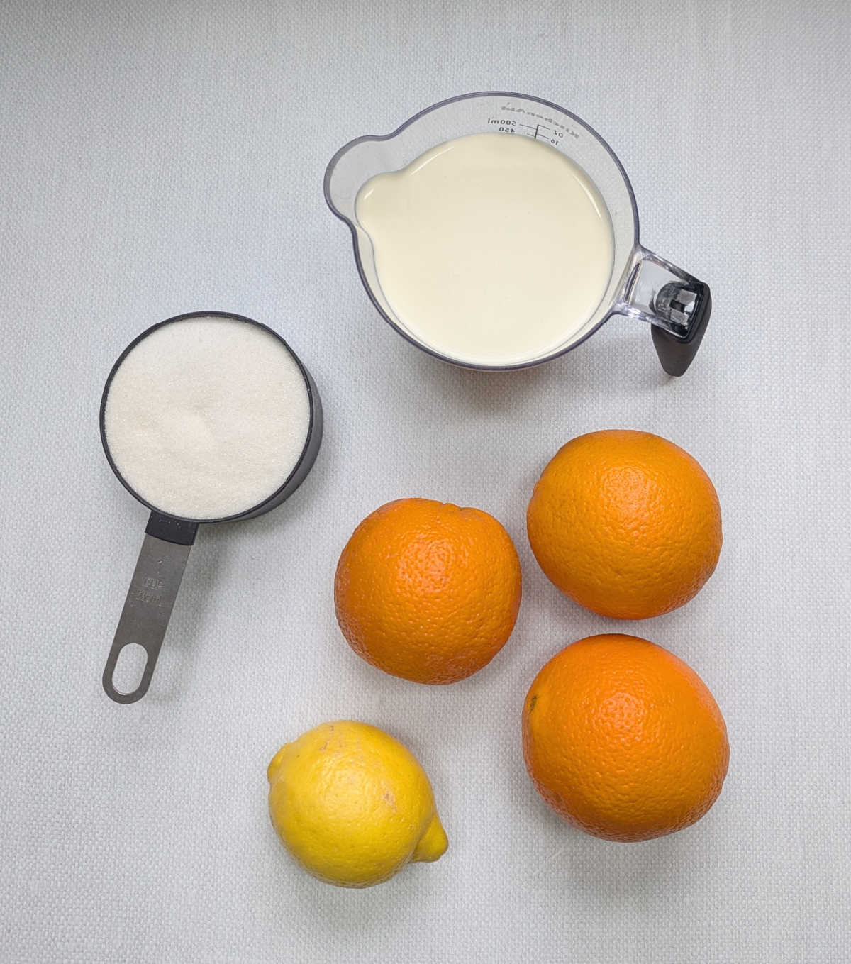 The ingredients needed to make Orange Lemon Posset.