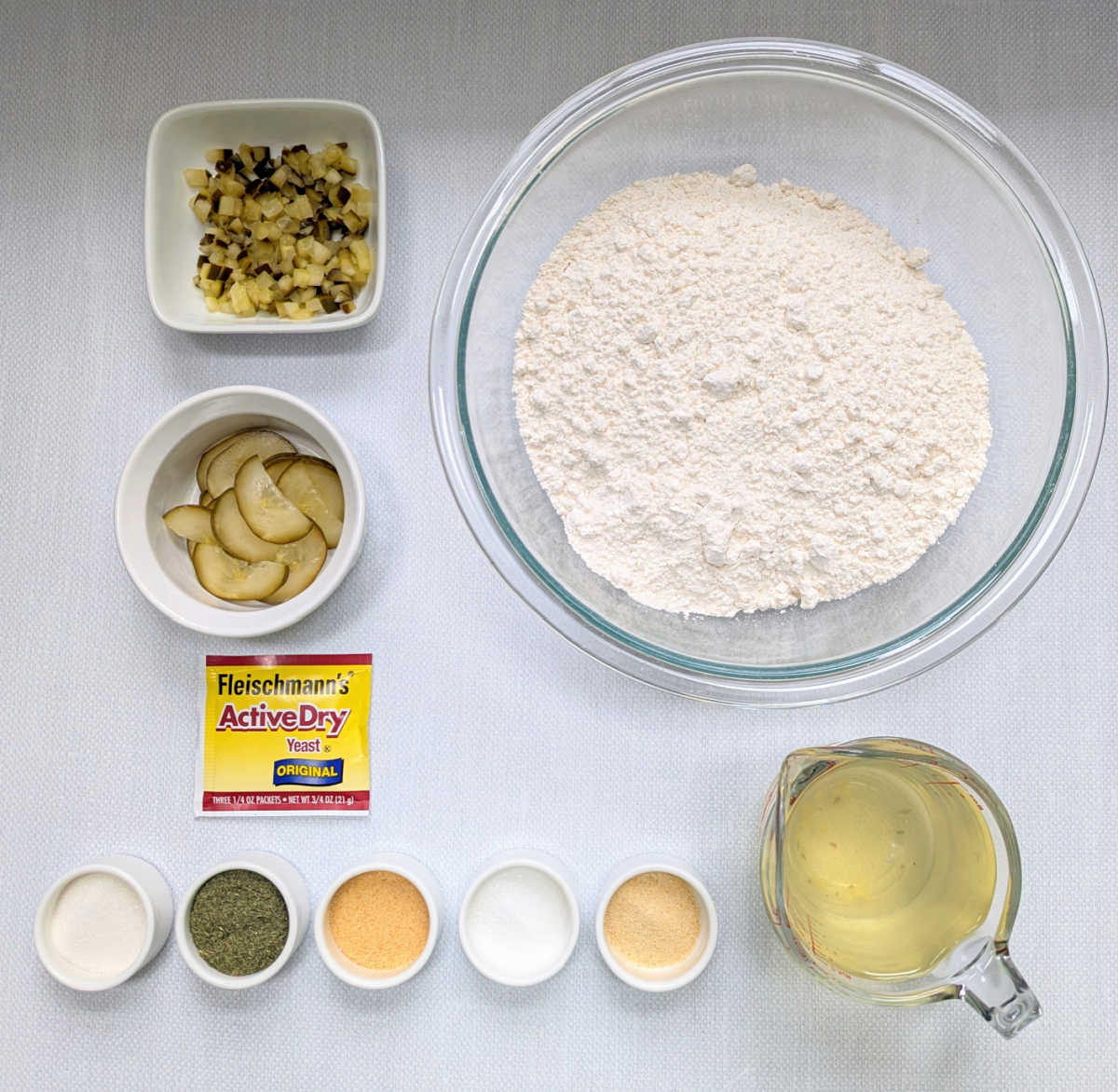 The ingredients needed to make No-Knead Dutch Oven Pickle Bread.