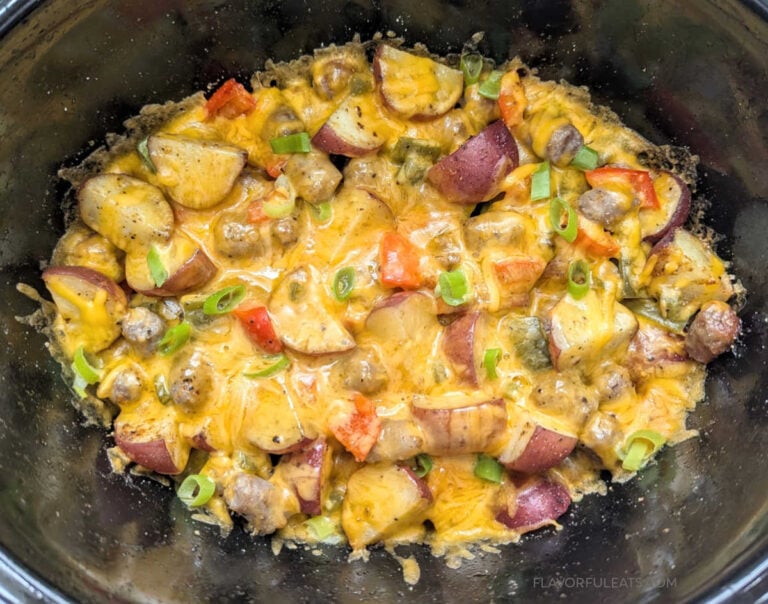 Slow Cooker Sausage Breakfast Hash in the slow cooker with cheese melted.