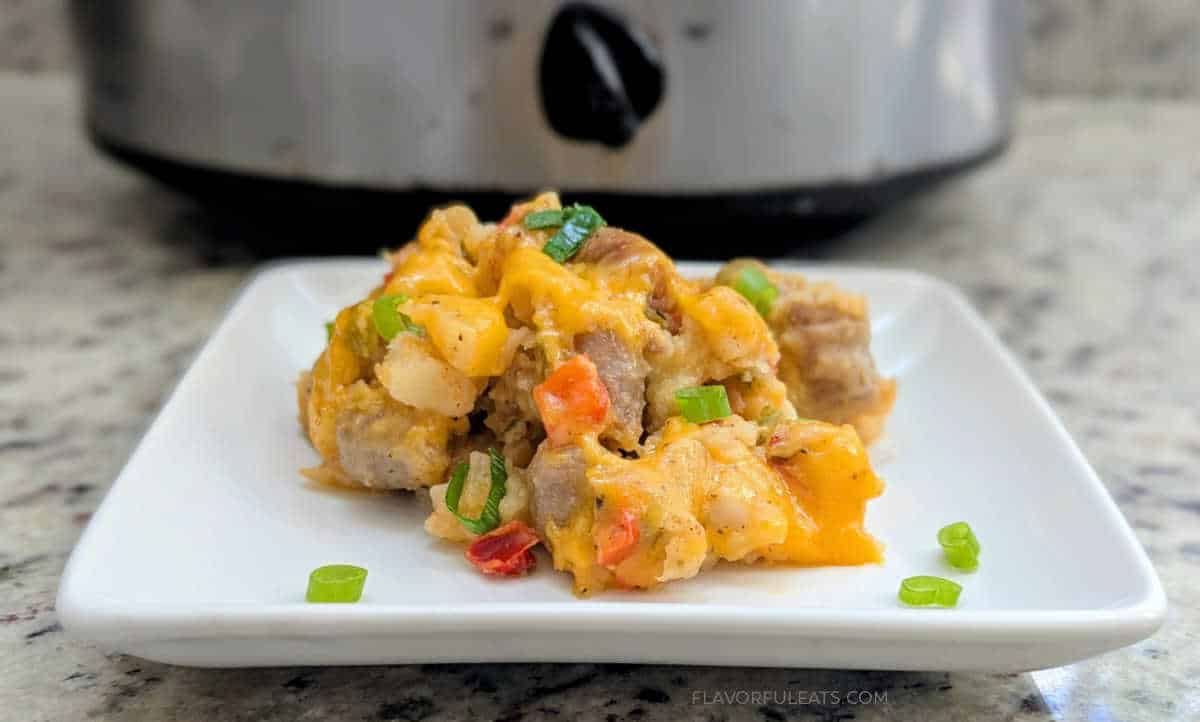 Slow Cooker Sausage Breakfast Hashed served on a white plate.