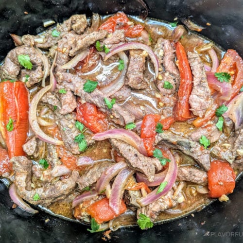 Slow Cooker Lomo Saltado in a slow cooker.