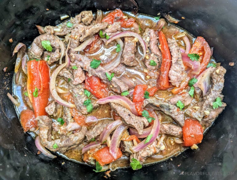 Slow Cooker Lomo Saltado in a slow cooker.
