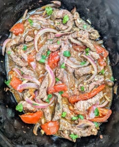 Slow Cooker Lomo Saltado cooked in the slow cooker.